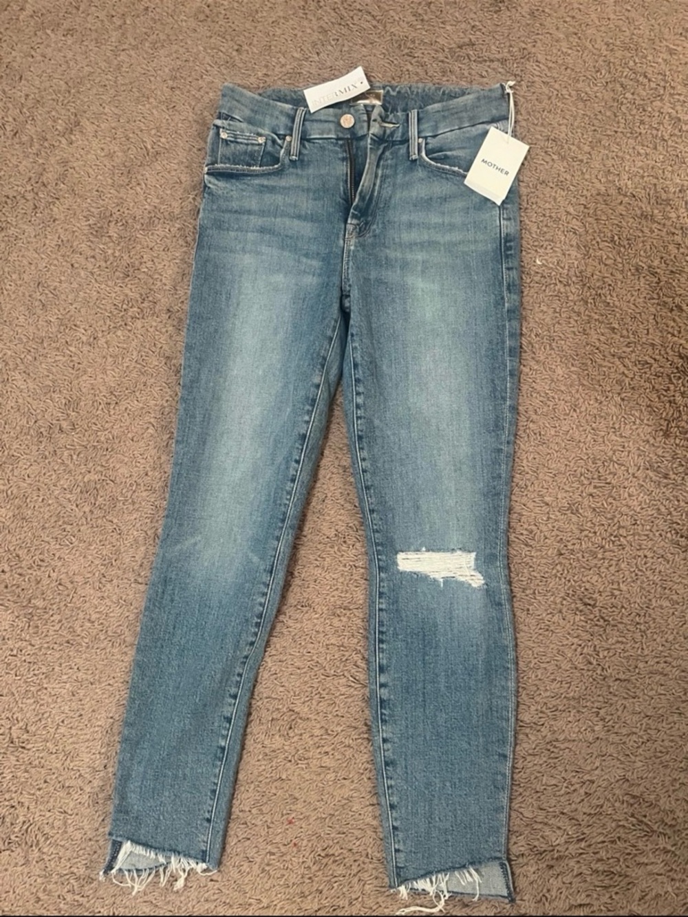 MOTHER Cropped Slim Straight Jeans in Light Blue with Distressed Knee